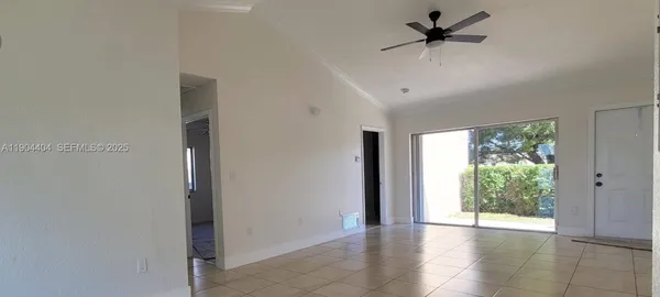 a view of an empty room with a window