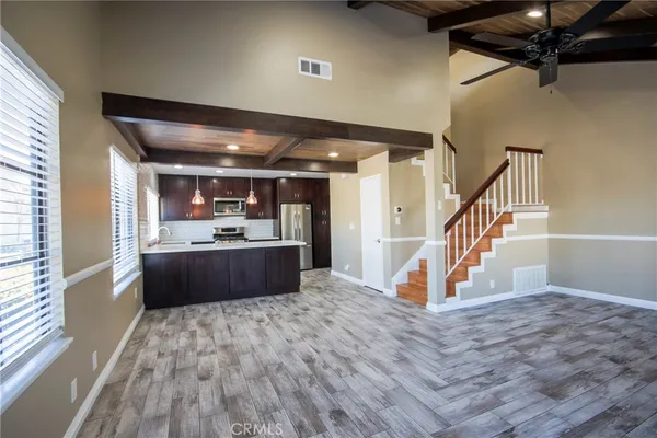 a view of kitchen and wooden floor
