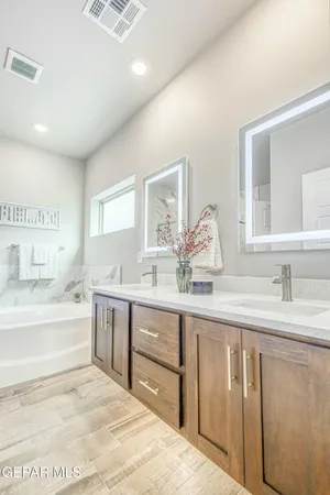 a view of a bathroom with a tub and shower