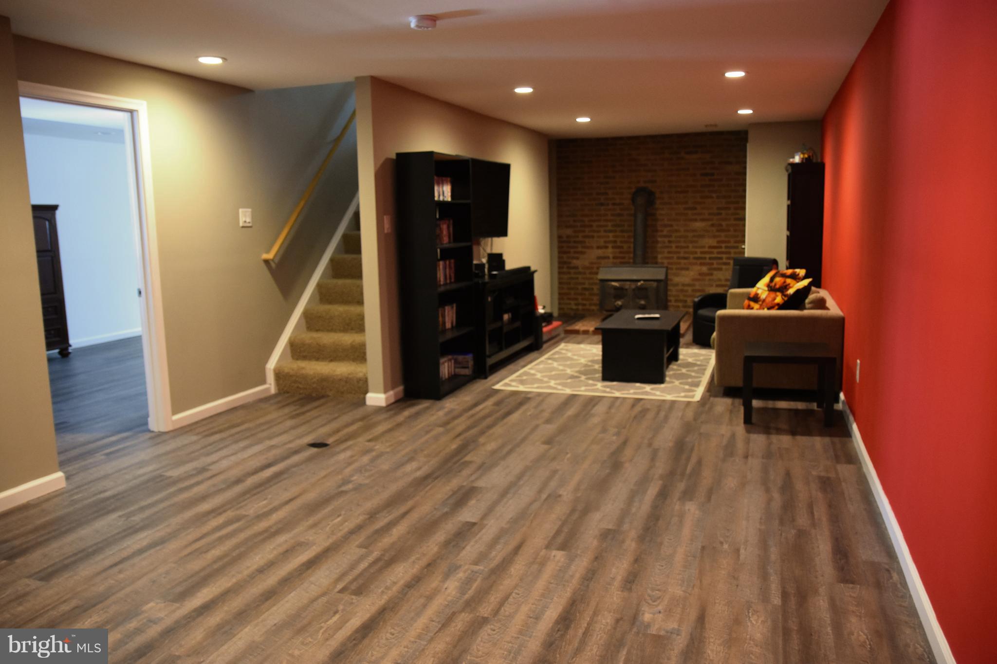 10043 Meetze Road Midland, VA 22728 - Photo 23 of 39 basement family room/ stairwell/door to bonus room