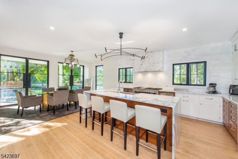 45 Village Road New Vernon, NJ 07976 - Photo 11 of 49 a kitchen with center island and stainless steel appliances