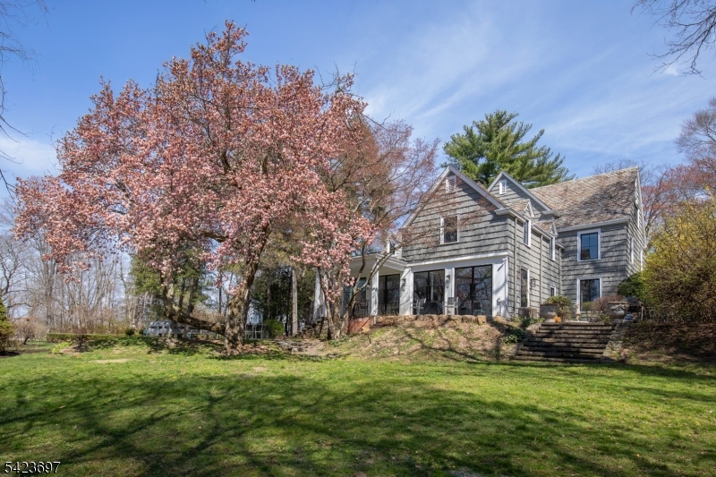 45 Village Road New Vernon, NJ 07976 - Photo 2 of 49 a front view of house with yard and green space