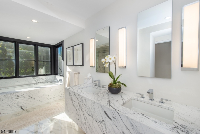 45 Village Road New Vernon, NJ 07976 - Photo 22 of 49 a bathroom with sink bathtub and window