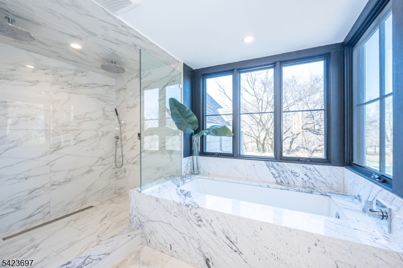 45 Village Road New Vernon, NJ 07976 - Photo 23 of 49 a spacious bathroom with a large tub and shower