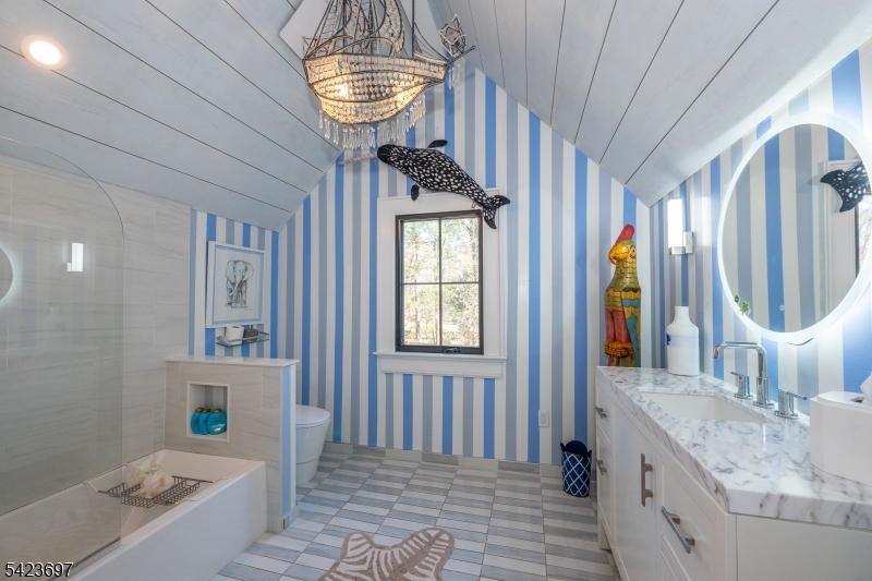 45 Village Road New Vernon, NJ 07976 - Photo 27 of 49 a bathroom with a sink a mirror and a window