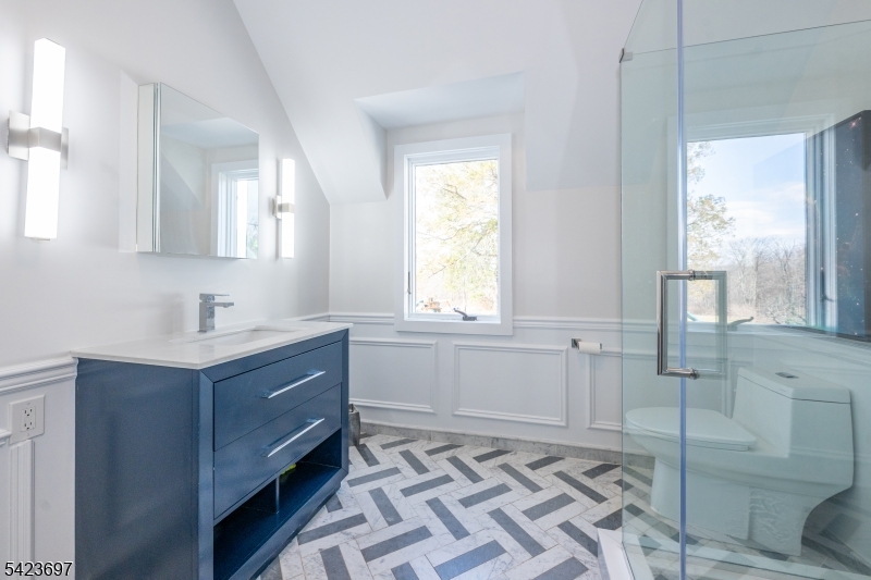 45 Village Road New Vernon, NJ 07976 - Photo 29 of 49 a bathroom with a sink mirror and a bathtub