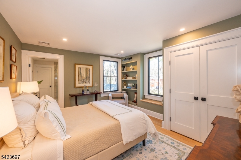 45 Village Road New Vernon, NJ 07976 - Photo 30 of 49 a spacious bedroom with a bed and glass door