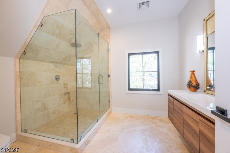 45 Village Road New Vernon, NJ 07976 - Photo 33 of 49 a bathroom with a tub shower and sink