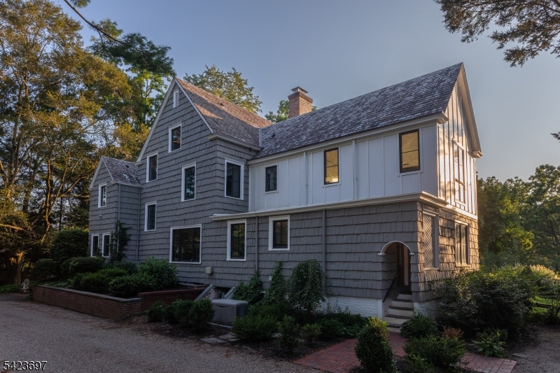 45 Village Road New Vernon, NJ 07976 - Photo 35 of 49 a front view of a house with plants