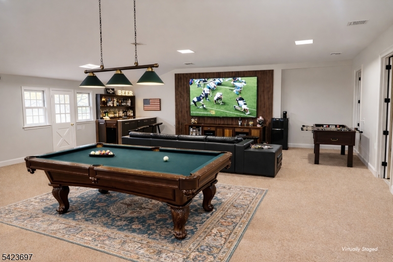 45 Village Road New Vernon, NJ 07976 - Photo 41 of 49 a living room with pool table and a flat screen tv