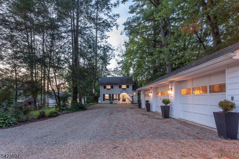 45 Village Road New Vernon, NJ 07976 - Photo 44 of 49 a view of a house with backyard and trees