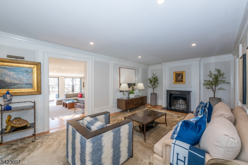 45 Village Road New Vernon, NJ 07976 - Photo 10 of 49 a living room with furniture and a fireplace