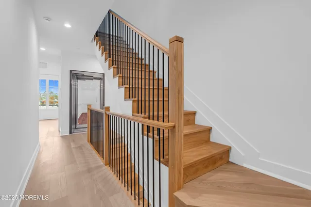 a bathroom with a double vanity sink toilet and shower