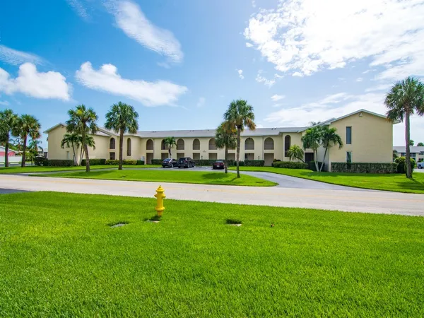 a view of yard with swimming pool and green space