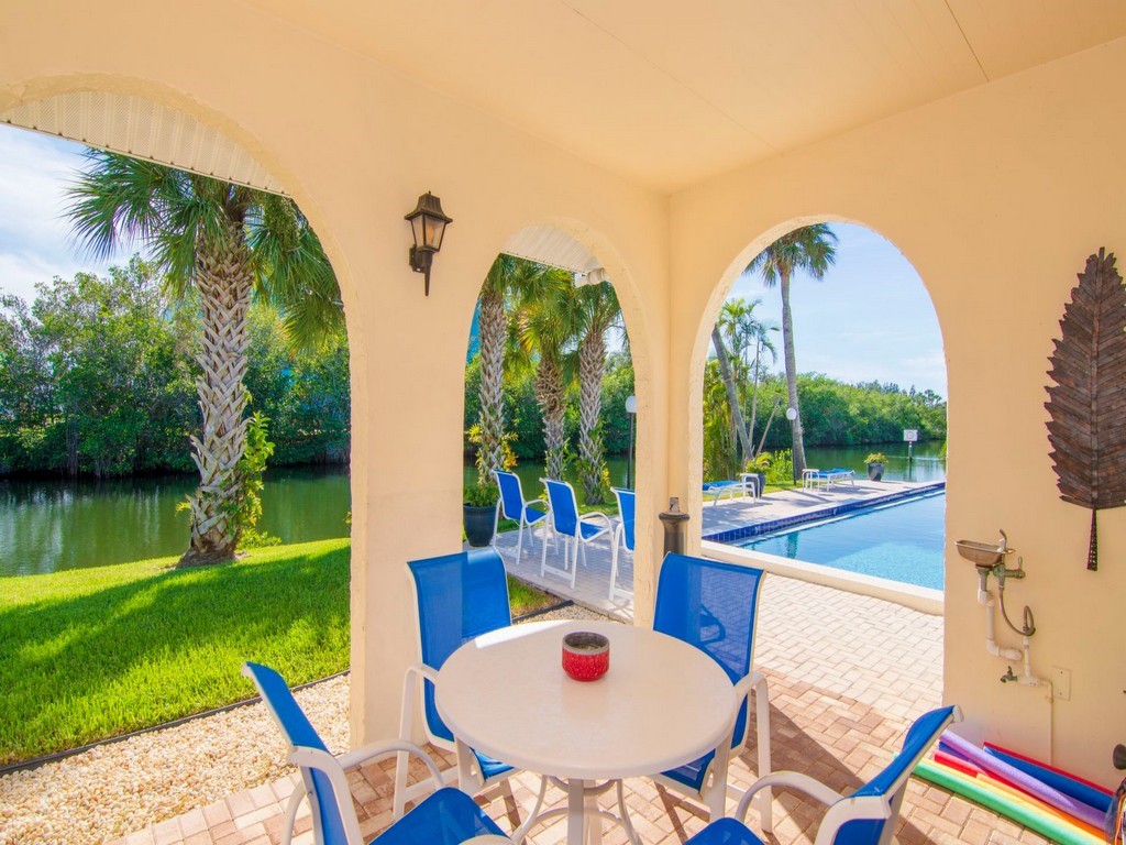 1860 Robalo Drive, Unit 203A Vero Beach, FL 32960 - Photo 26 of 36 a view of a swimming pool with a backyard