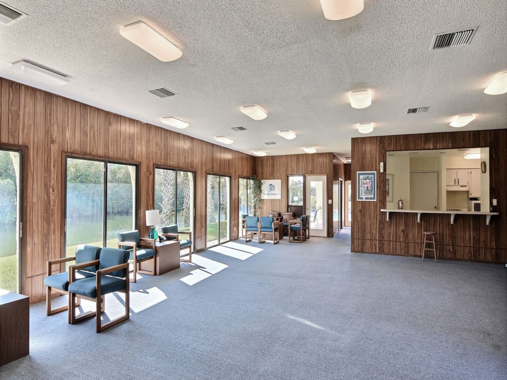 1860 Robalo Drive, Unit 203A Vero Beach, FL 32960 - Photo 30 of 36 a large room with large windows