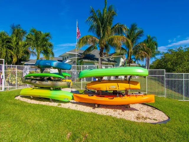 a view of a backyard with swimming pool