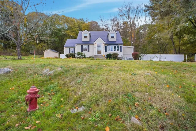 a house view with a sitting space and garden view