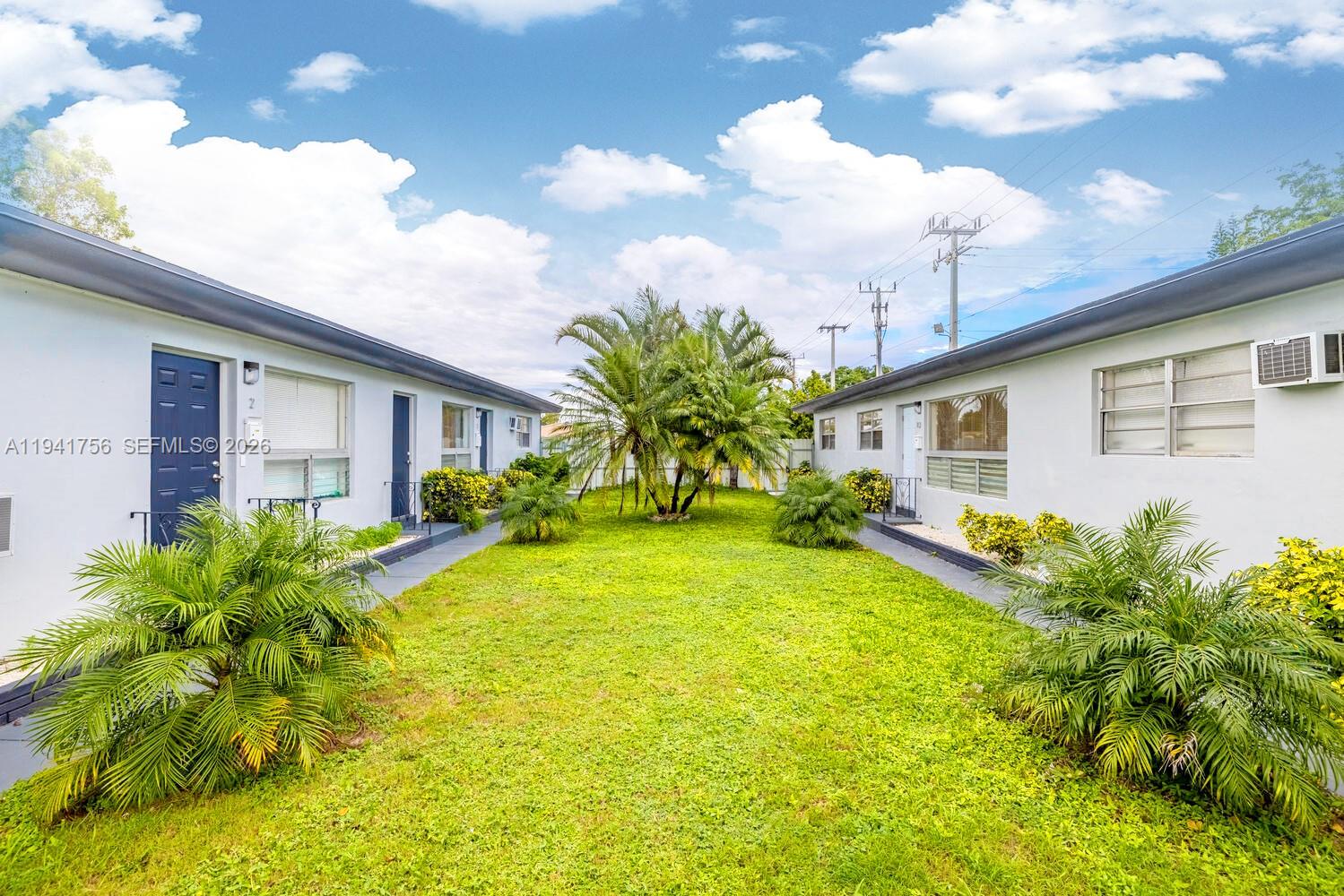 2206 Fillmore Street, Unit 3 Hollywood, FL 33020 - Photo 12 of 12 a front view of a house with garden