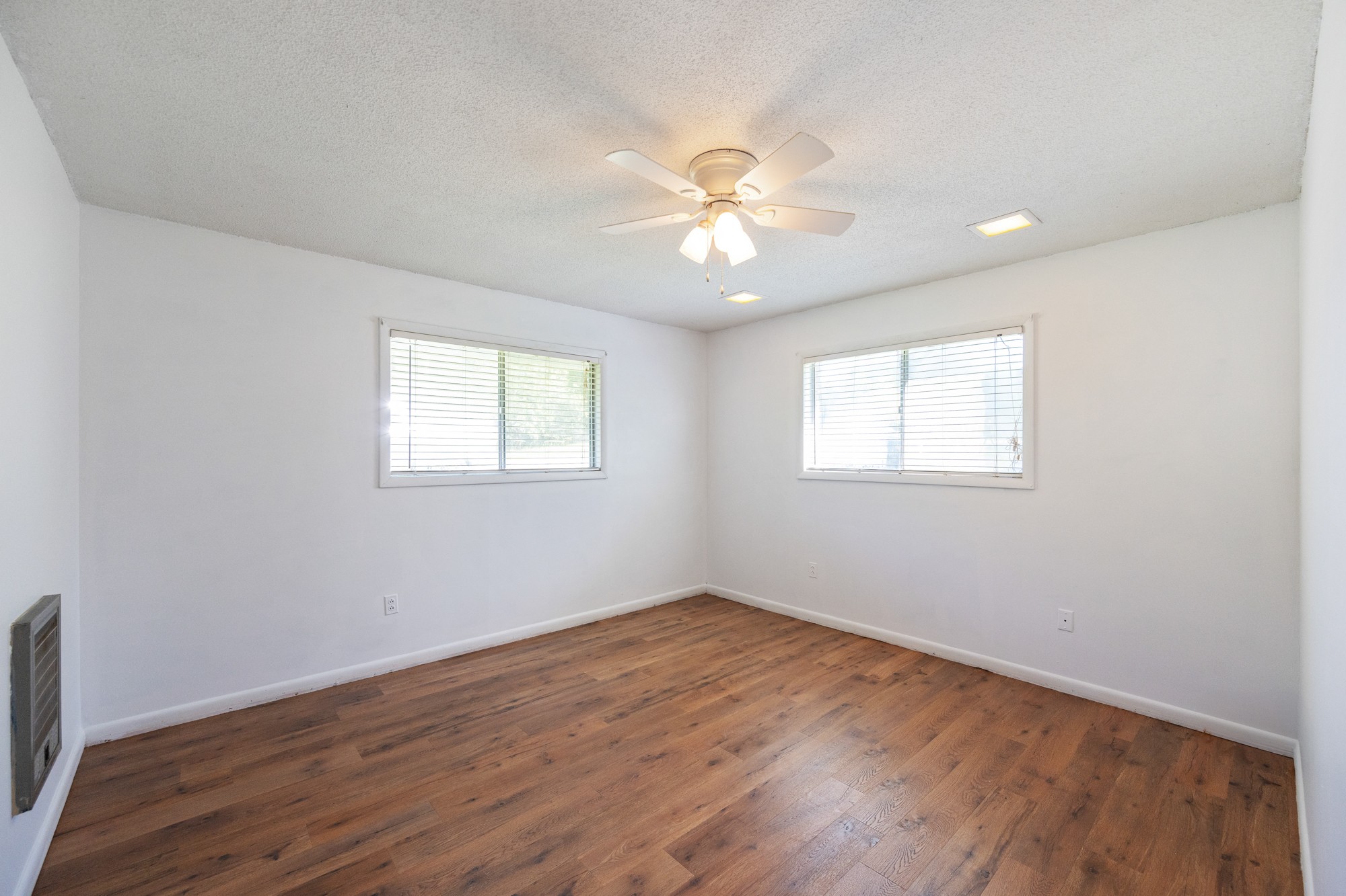 53 Elm Street Decaturville, TN 38329 - Photo 20 of 44 a view of an empty room with wooden floor and a window
