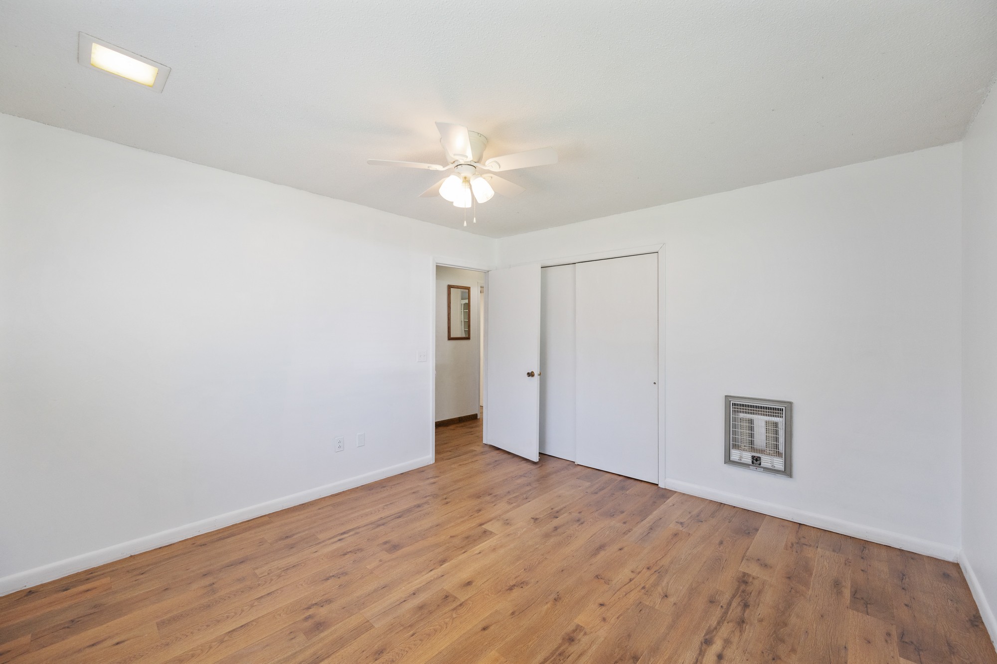 53 Elm Street Decaturville, TN 38329 - Photo 22 of 44 wooden floor in an empty room