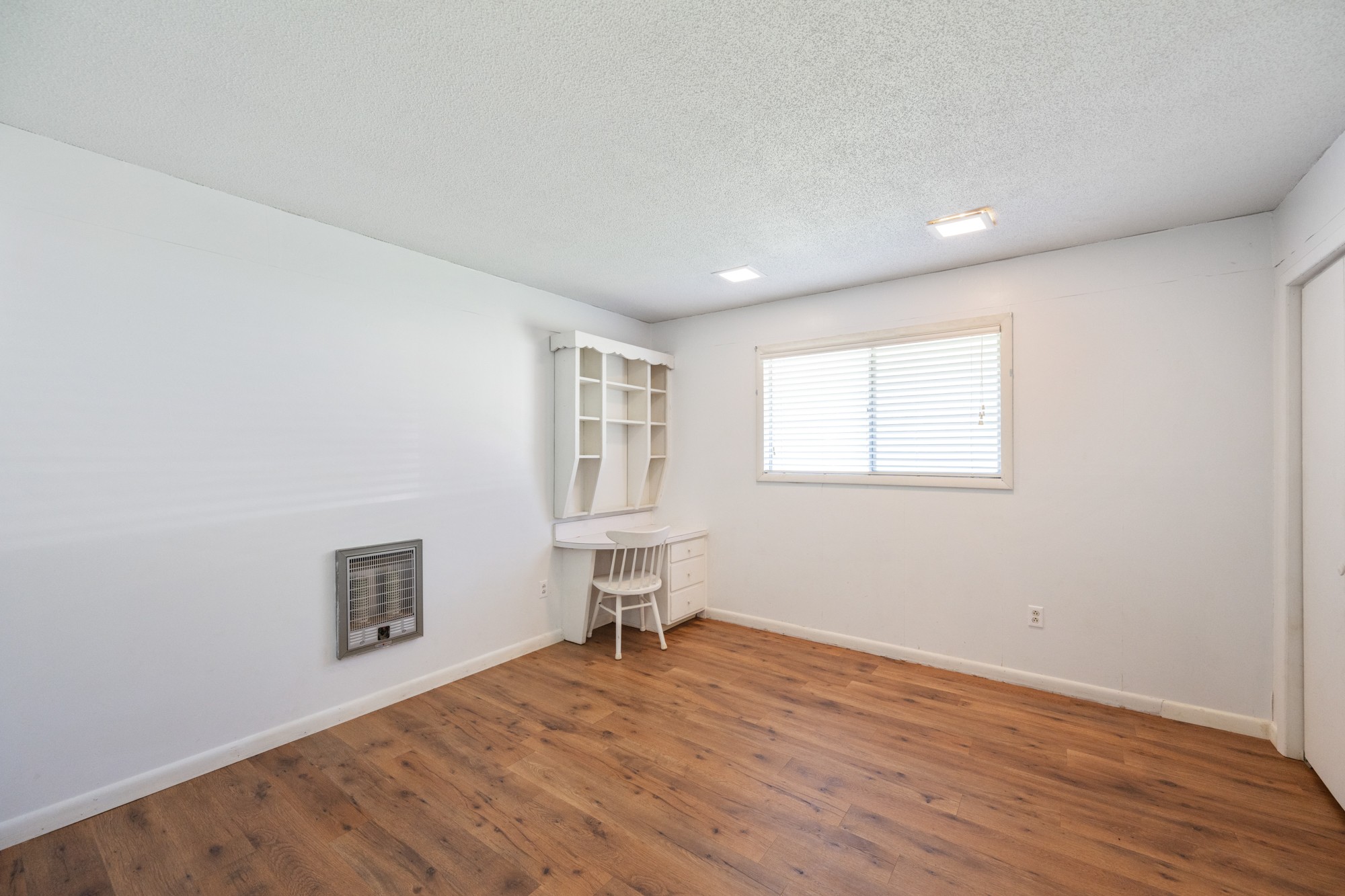 53 Elm Street Decaturville, TN 38329 - Photo 24 of 44 a view of empty room with wooden floor and fan