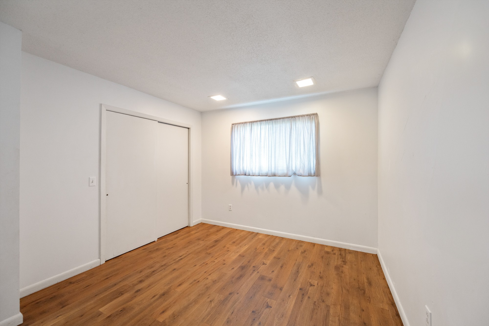 53 Elm Street Decaturville, TN 38329 - Photo 28 of 44 a view of empty room with wooden floor
