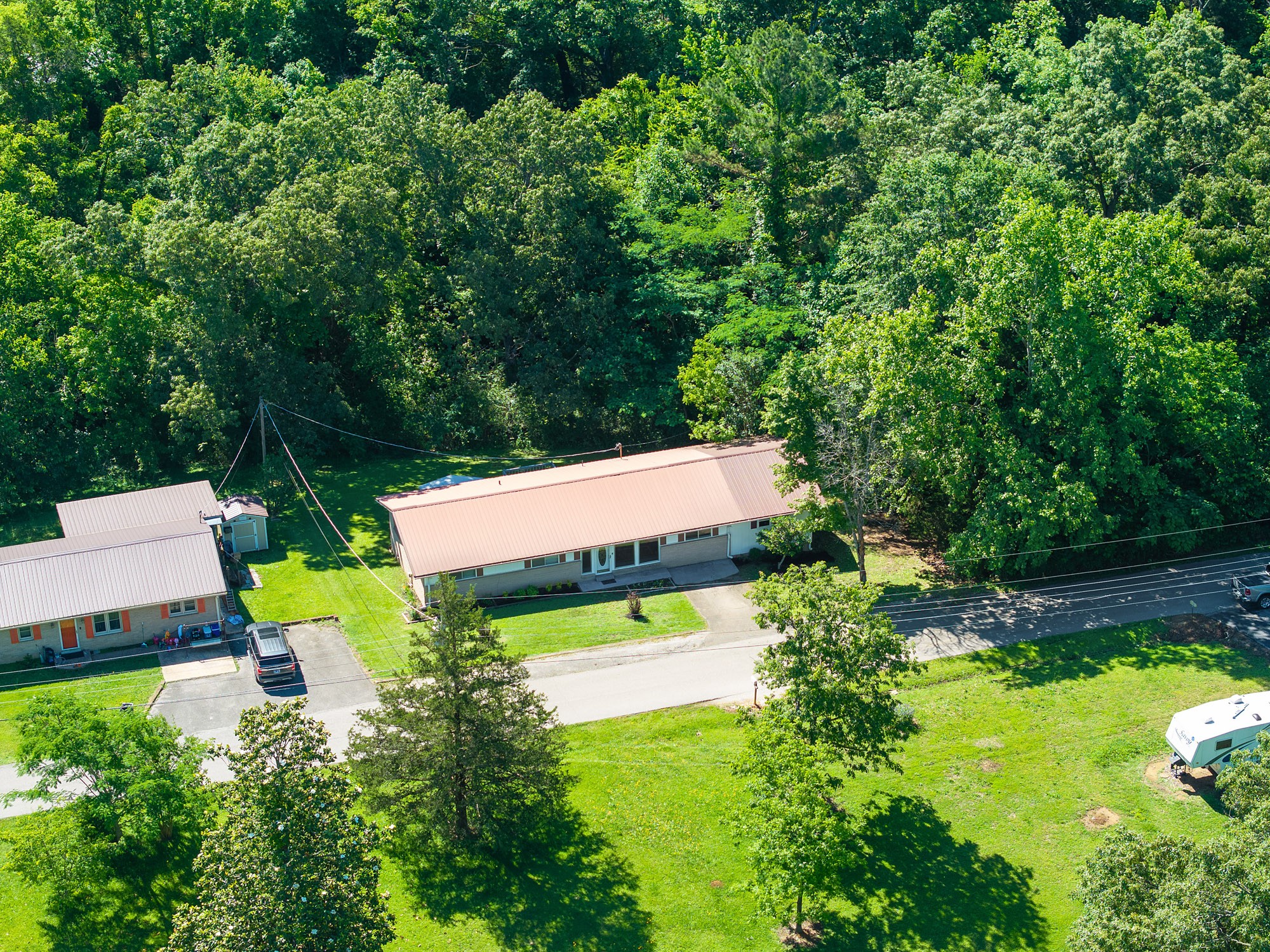 53 Elm Street Decaturville, TN 38329 - Photo 37 of 44 an aerial view of a house with pool outdoor seating and yard