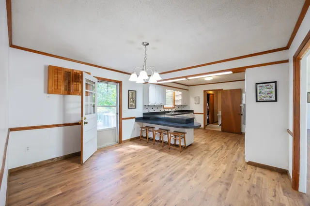 a bedroom with a bed and a mirror