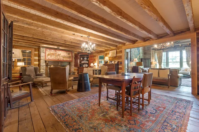 a view of entryway livingroom and hall with wooden floor