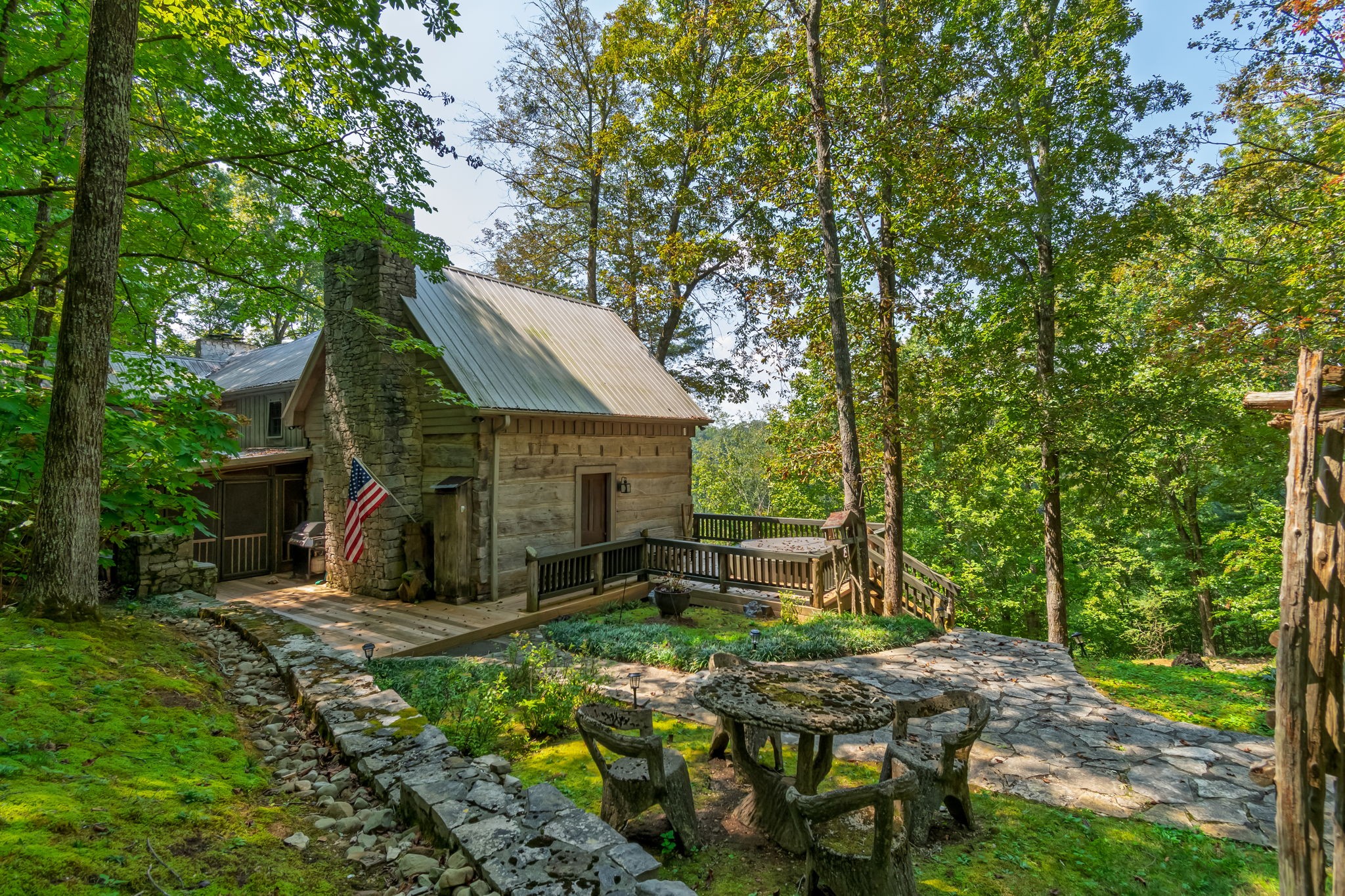 658 Moore Road Doyle, TN 38559 - Photo 17 of 92 a view of backyard with table and chairs and a large tree