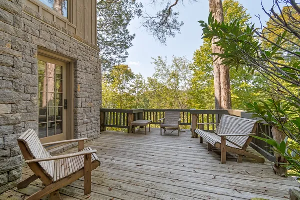 a view of a balcony with chairs