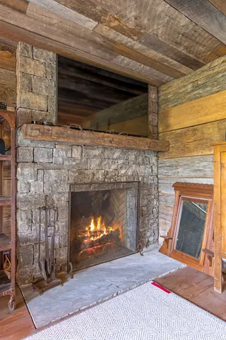 a bathroom with a toilet a sink and a large mirror