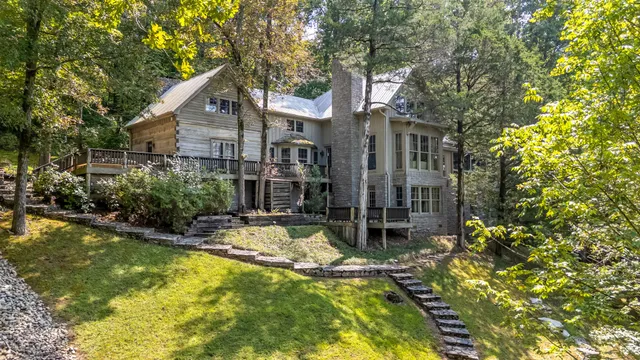 a view of a patio with table and chairs