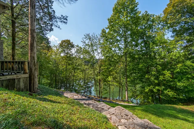 a backyard of a house with outdoor seating and green space