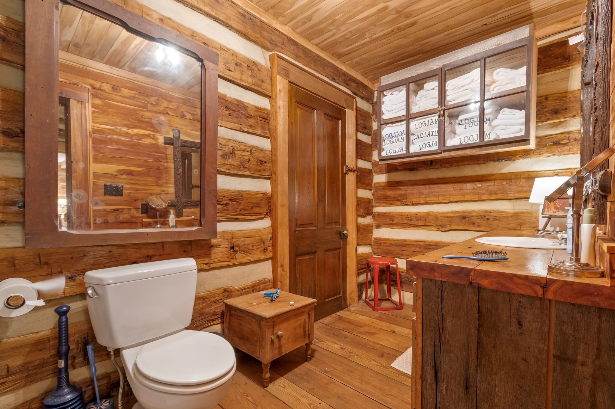 658 Moore Road Doyle, TN 38559 - Photo 58 of 92 a bathroom with a toilet a sink and a large mirror