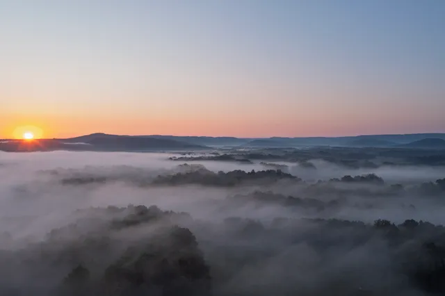 a open kitchen with stainless steel appliances granite countertop a stove and cabinets