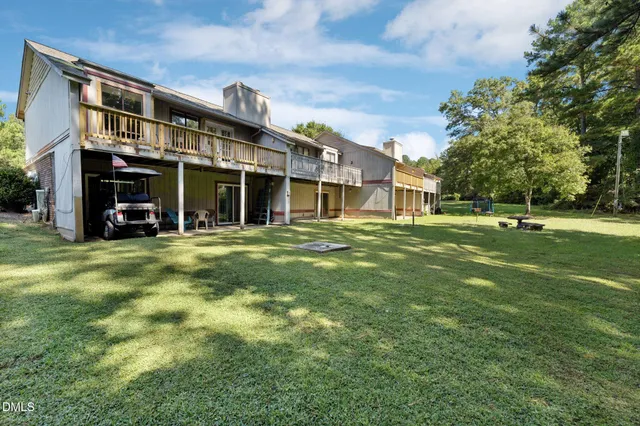 an aerial view of a house with a lake view