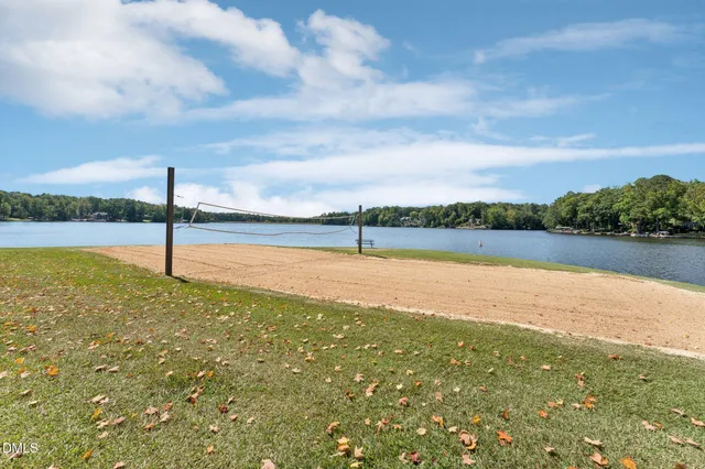 a view of a swimming pool with a lake view