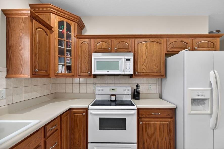 15 Fast Lane Ranburne, AL 36273 - Photo 30 of 51 a kitchen with stainless steel appliances granite countertop a refrigerator a sink and white cabinets