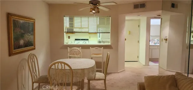 a view of a livingroom with furniture window and wooden floor