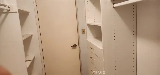 a bathroom with a shower and a mirror