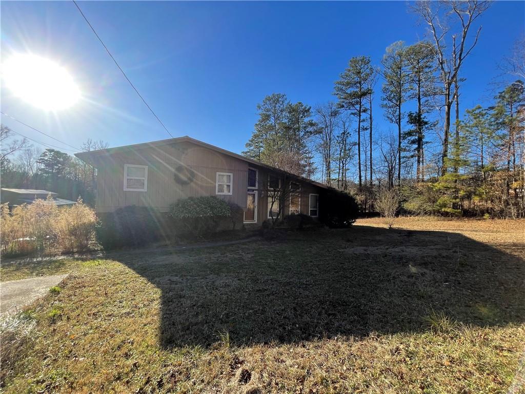 11820 Upper Wooten Road Palmetto, GA 30268 - Photo 12 of 12 a view of a house with a yard