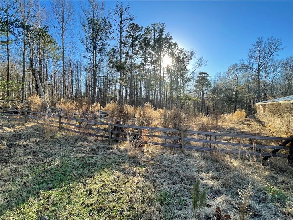 11820 Upper Wooten Road Palmetto, GA 30268 - Photo 8 of 12 a view of a lake with lots of trees
