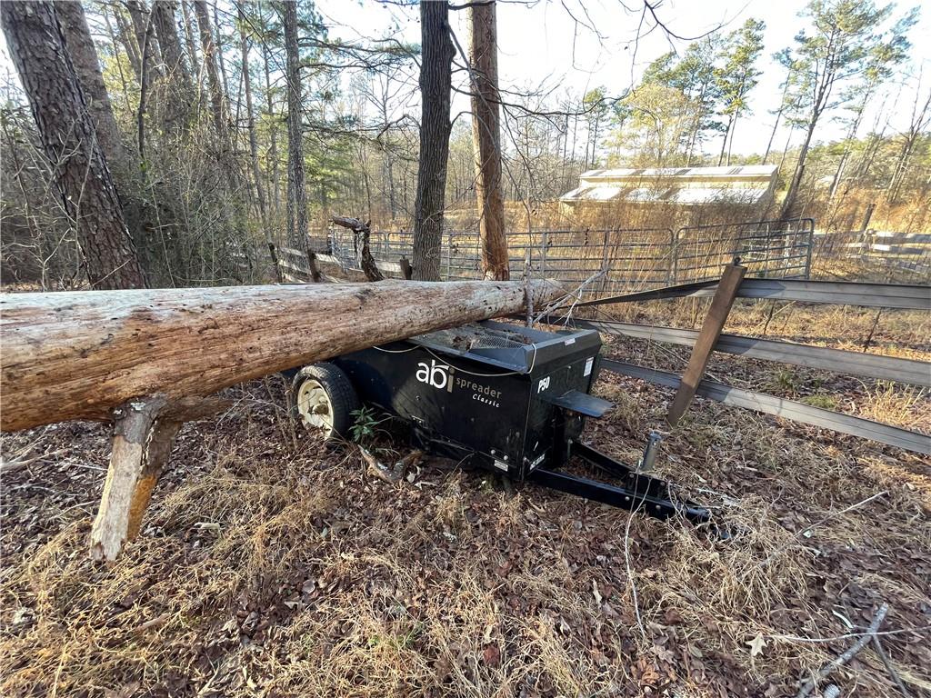 11820 Upper Wooten Road Palmetto, GA 30268 - Photo 10 of 12 a view of backyard with wooden fence and trees