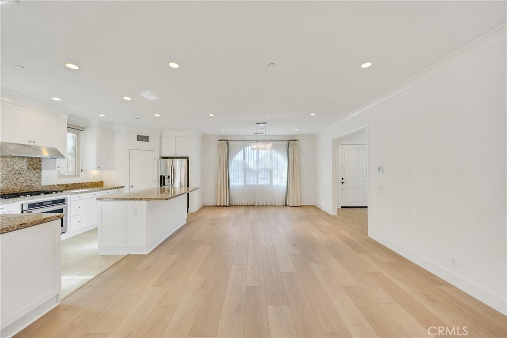 107 Hanging Garden Irvine, CA 92620 - Photo 11 of 26 a view of large kitchen with marble top and stainless steel appliances