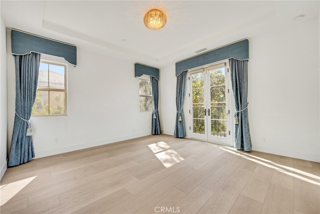 107 Hanging Garden Irvine, CA 92620 - Photo 17 of 26 a view of an empty room with a window