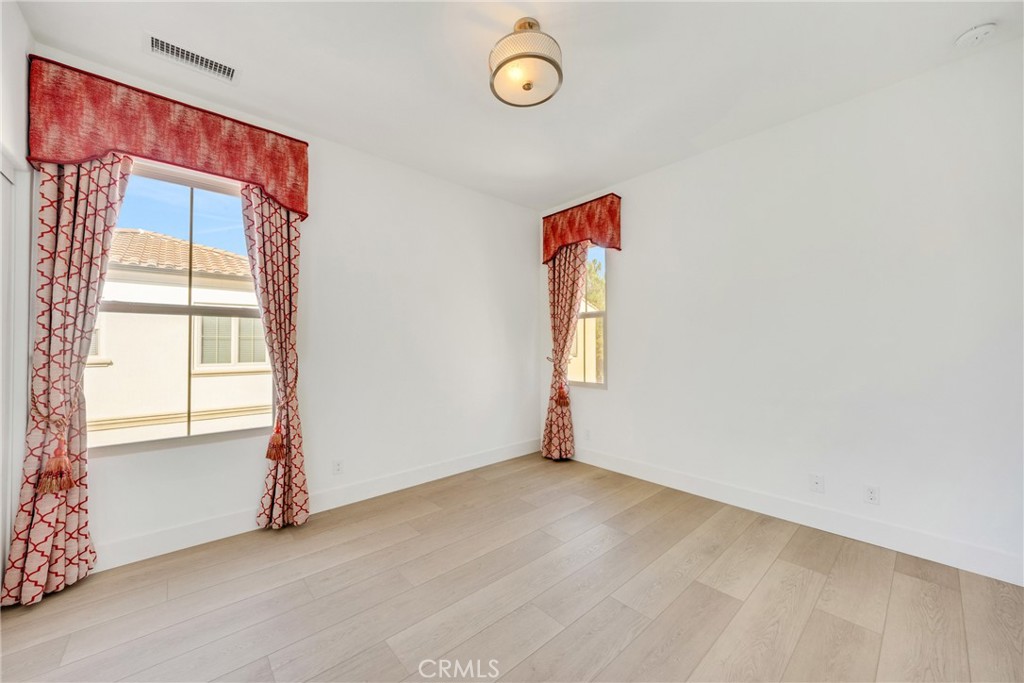 107 Hanging Garden Irvine, CA 92620 - Photo 21 of 26 an empty room with a window