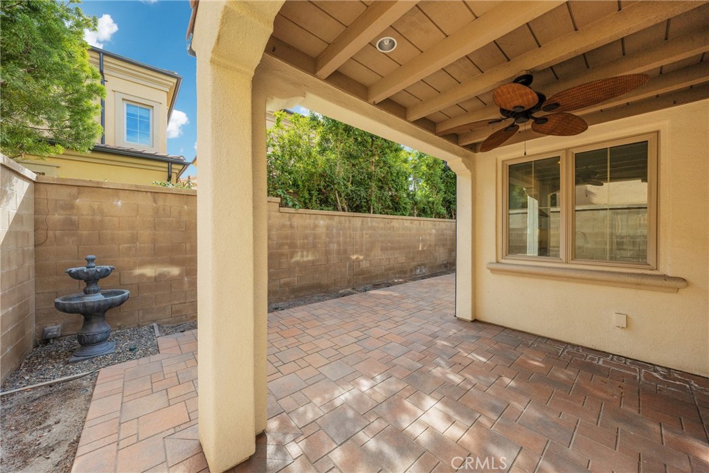 107 Hanging Garden Irvine, CA 92620 - Photo 23 of 26 a view of a porch with plants and wooden floor