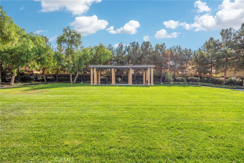 107 Hanging Garden Irvine, CA 92620 - Photo 26 of 26 a view of a house with a yard